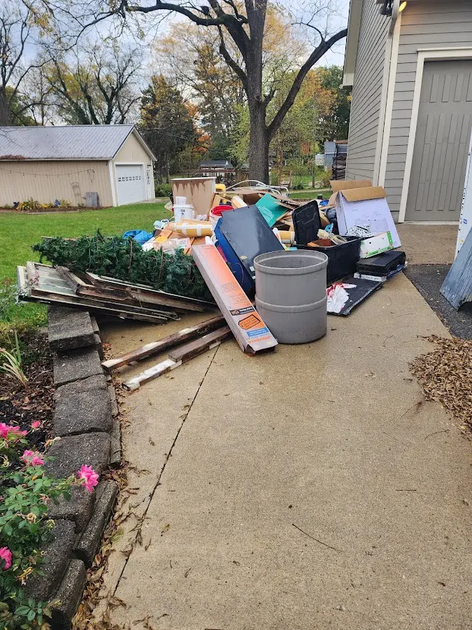 Dumpster being loaded with debris for Commercial Dumpster Rental in Wayne